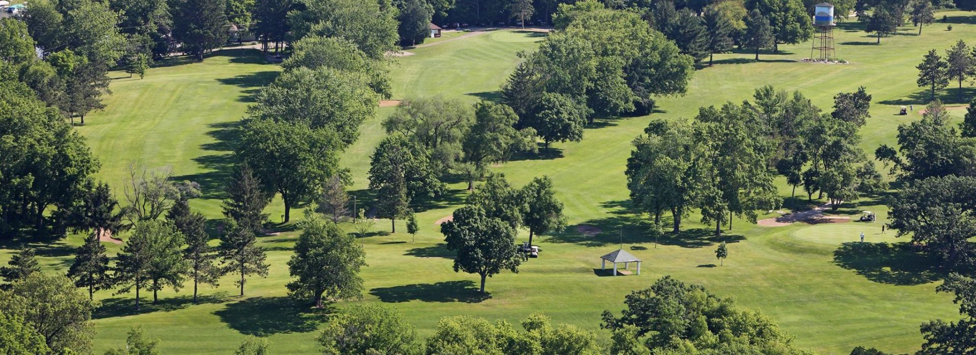 View of golf course with trees