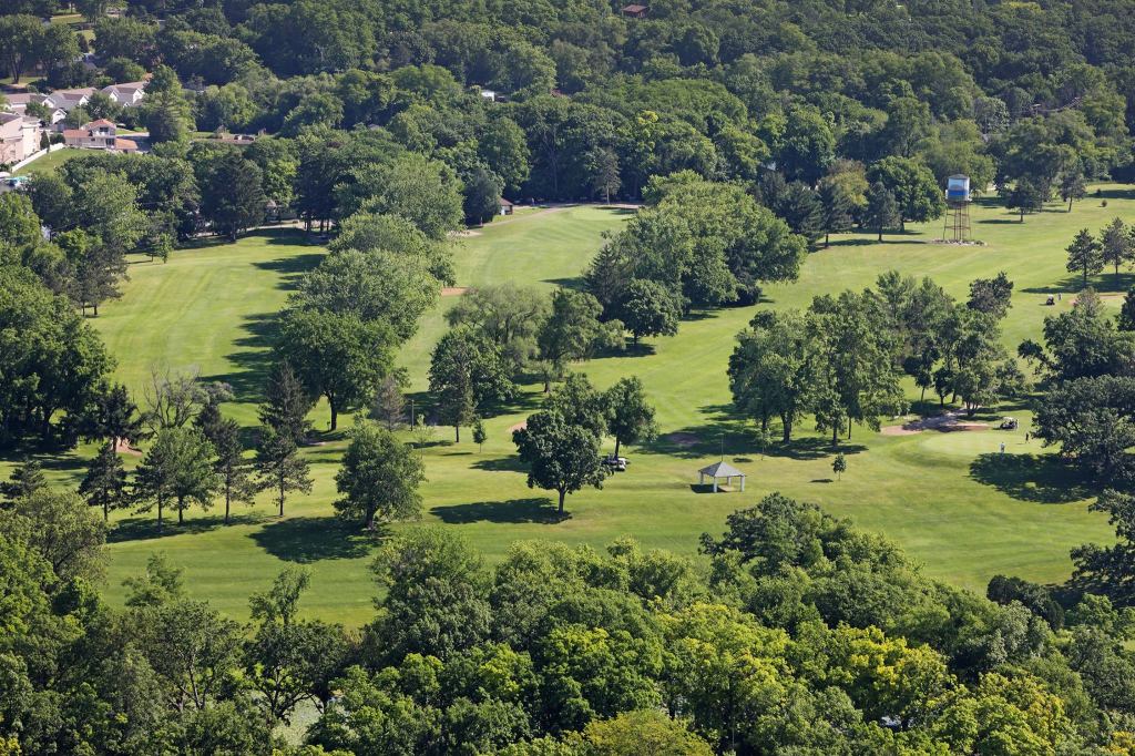 View of golf course with trees